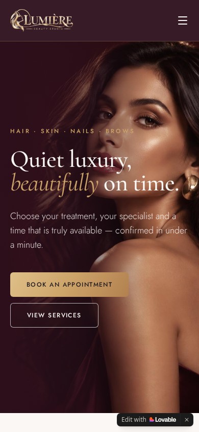 Actual Lumière mobile homepage showing the salon portrait, luxury typography and booking button